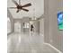 Bright living room featuring tile flooring, recessed lighting, and high ceilings at 1706 Terra Cota Ct, Orlando, FL 32825