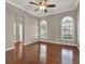 A spacious main bedroom with hardwood floors and arched windows at 1706 Terra Cota Ct, Orlando, FL 32825