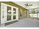 The covered patio has a ceiling fan and plenty of space for outdoor enjoyment at 1706 Terra Cota Ct, Orlando, FL 32825