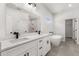 Modern bathroom with double vanity, bathtub, shower, and tile flooring at 17465 Sw 41St Cir, Ocala, FL 34473