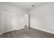 Spacious bedroom with wood floors, closet, and neutral paint at 17465 Sw 41St Cir, Ocala, FL 34473