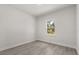 Bedroom features wood floors, natural light from the window, and neutral paint at 17465 Sw 41St Cir, Ocala, FL 34473