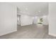 Expansive living area with light gray floors, recessed lighting, and sliding glass doors at 17465 Sw 41St Cir, Ocala, FL 34473