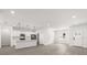 Bright, open-concept living space with wood-look flooring and access to the kitchen at 17465 Sw 41St Cir, Ocala, FL 34473
