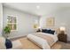 Cozy main bedroom with carpet, natural light from the windows, and tasteful decor at 17465 Sw 41St Cir, Ocala, FL 34473