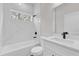 Bathroom with a shower and tub combination and vanity with quartz countertop at 17501 Sw 41St Cir, Ocala, FL 34473