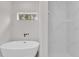 Bright bathroom featuring a freestanding tub and a walk-in shower with marble tile at 17501 Sw 41St Cir, Ocala, FL 34473