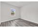 Bedroom features gray flooring and a view to the outdoors at 17501 Sw 41St Cir, Ocala, FL 34473