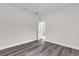 Bedroom featuring gray flooring, neutral paint, and door to other rooms at 17501 Sw 41St Cir, Ocala, FL 34473