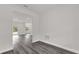 Hallway with durable gray flooring leading to the entryway and other rooms at 17501 Sw 41St Cir, Ocala, FL 34473