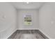 Bright room with modern flooring, a window view, and neutral paint at 17501 Sw 41St Cir, Ocala, FL 34473
