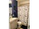 Compact bathroom with modern sink vanity and shower featuring a Parisian-themed curtain at 1907 Myakka Ct, Poinciana, FL 34759