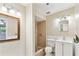Bathroom featuring a shower stall with tile surround, vanity, and mirror at 191 Ruskin St, Lake Mary, FL 32746
