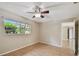 Comfortable bedroom with neutral walls, a ceiling fan and ample natural light at 191 Ruskin St, Lake Mary, FL 32746