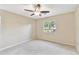 Bedroom with neutral walls, carpet, and a window offering natural light at 191 Ruskin St, Lake Mary, FL 32746