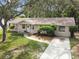 Charming single-story home with a well-manicured lawn and a welcoming entrance at 191 Ruskin St, Lake Mary, FL 32746