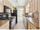Functional kitchen featuring appliances and ample counter space at 191 Ruskin St, Lake Mary, FL 32746