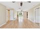 Open concept living room with sliding doors leading to the backyard at 191 Ruskin St, Lake Mary, FL 32746