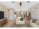 Bright living room featuring a comfortable seating area and an adjacent dining space at 191 Ruskin St, Lake Mary, FL 32746