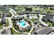 Aerial shot of the community pool, playground, and surrounding neighborhood homes at 2035 White Feather Loop, Oakland, FL 34787
