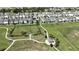 Aerial view of a community featuring well-maintained lawns, walking paths, and community park at 2035 White Feather Loop, Oakland, FL 34787