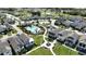 Beautiful aerial view of community pool, clubhouse, and manicured green spaces at 2035 White Feather Loop, Oakland, FL 34787