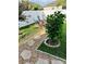 Beautiful backyard with stone pathway, a patio area, flowering trees, and a privacy fence at 2051 Sandy Garden Ln, Winter Garden, FL 34787