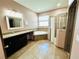 Bathroom with a walk-in shower, soaking tub, dark vanity with granite countertops, and tiled floors at 2051 Sandy Garden Ln, Winter Garden, FL 34787