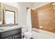 Cozy bathroom featuring a tub and shower combination with elegant fixtures for a relaxing experience at 2051 Sandy Garden Ln, Winter Garden, FL 34787