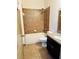 Bathroom with shower-tub combo and vanity with granite counter at 2051 Sandy Garden Ln, Winter Garden, FL 34787