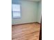 Bedroom with wood laminate flooring and a window at 2051 Sandy Garden Ln, Winter Garden, FL 34787