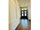 Inviting entryway featuring double doors with decorative wreaths and tile flooring, leading into the home's interior at 2051 Sandy Garden Ln, Winter Garden, FL 34787
