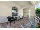 Welcoming front porch featuring brick flooring and comfortable seating area to enjoy the outdoors at 2051 Sandy Garden Ln, Winter Garden, FL 34787