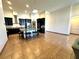Spacious kitchen with a central island, dark cabinets, stainless steel appliances, and an open floor plan at 2051 Sandy Garden Ln, Winter Garden, FL 34787