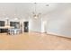 Open concept living area with tile floors, dark cabinets, an eat-in island and high ceilings at 2051 Sandy Garden Ln, Winter Garden, FL 34787