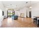 Open concept living area with tile floors, lots of natural light, and an adjacent staircase at 2051 Sandy Garden Ln, Winter Garden, FL 34787