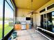 Spacious outdoor kitchen with stainless steel grill and patio, perfect for entertaining in the Florida sunshine at 2051 Sandy Garden Ln, Winter Garden, FL 34787