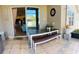 Charming outdoor patio space with a dining table and view to the interior of the house at 2051 Sandy Garden Ln, Winter Garden, FL 34787