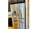 Stainless steel Whirlpool refrigerator with filtered water dispenser and pull out freezer drawer in the kitchen at 2051 Sandy Garden Ln, Winter Garden, FL 34787