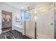 Bathroom featuring a glass-enclosed shower, soaking tub, and walk-in closet at 2068 Ashwood Bluff Dr, Ocoee, FL 34761