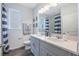 Stylish bathroom featuring a double vanity, large mirror, and striped decor for a nautical vibe at 2068 Ashwood Bluff Dr, Ocoee, FL 34761