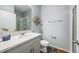Clean and modern bathroom with gray cabinets, white countertops, and a glass-enclosed shower at 2068 Ashwood Bluff Dr, Ocoee, FL 34761