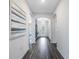 Inviting foyer with dark wood floors, archways and stylish decor at 2068 Ashwood Bluff Dr, Ocoee, FL 34761