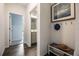 Welcoming entryway featuring wood-style flooring and providing access to a well-lit bathroom at 2068 Ashwood Bluff Dr, Ocoee, FL 34761