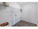 Empty laundry room featuring vinyl flooring, open shelving, and laundry hookups at 2068 Ashwood Bluff Dr, Ocoee, FL 34761