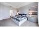 Elegant bedroom featuring a tray ceiling, large windows, and stylish decor at 2068 Ashwood Bluff Dr, Ocoee, FL 34761
