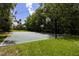 Enjoy the community's basketball court surrounded by mature trees, perfect for outdoor fun at 211 Crown Oaks Way # 205, Longwood, FL 32779
