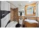Bathroom with tile shower/tub, vanity and updated fixtures at 211 Crown Oaks Way # 205, Longwood, FL 32779