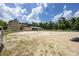 A vast equestrian arena with a barn, offering ample space and facilities for equestrian activities at 211 Crown Oaks Way # 205, Longwood, FL 32779