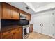 Kitchen featuring wood cabinets, stainless steel appliances, and tiled floors at 211 Crown Oaks Way # 205, Longwood, FL 32779